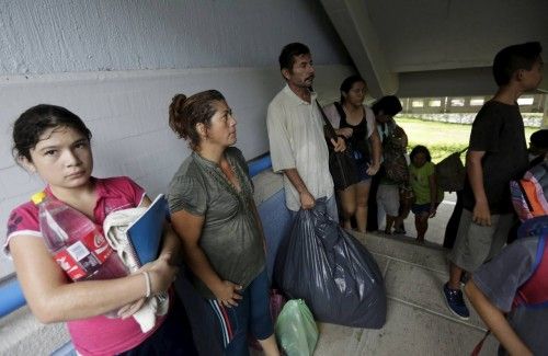 Residents, who were evacuated from their homes arrive at the University of Puerto Vallarta used as a shelter as Hurricane Patricia approaches the Pacific beach resort of Puerto Vallarta