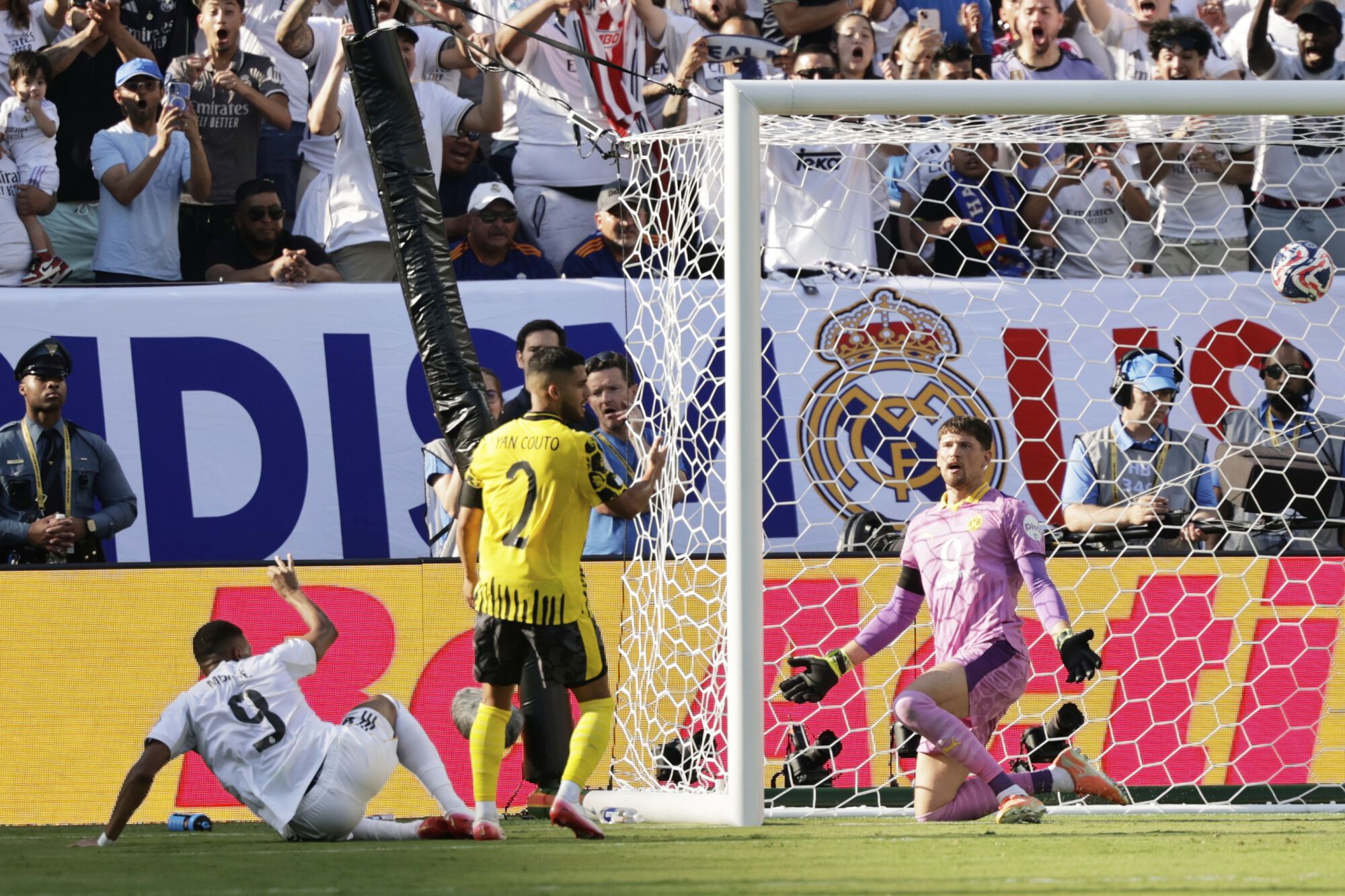 Real Madrid's Kylian Mbappe, left, scores his side's third goal against Borussia Dortmund during the Club World Cup quarterfinal soccer match between Real Madrid and Borussia Dortmund in East Rutherford, N.J., Saturday, July 5, 2025. (AP Photo/Adam Hunger)