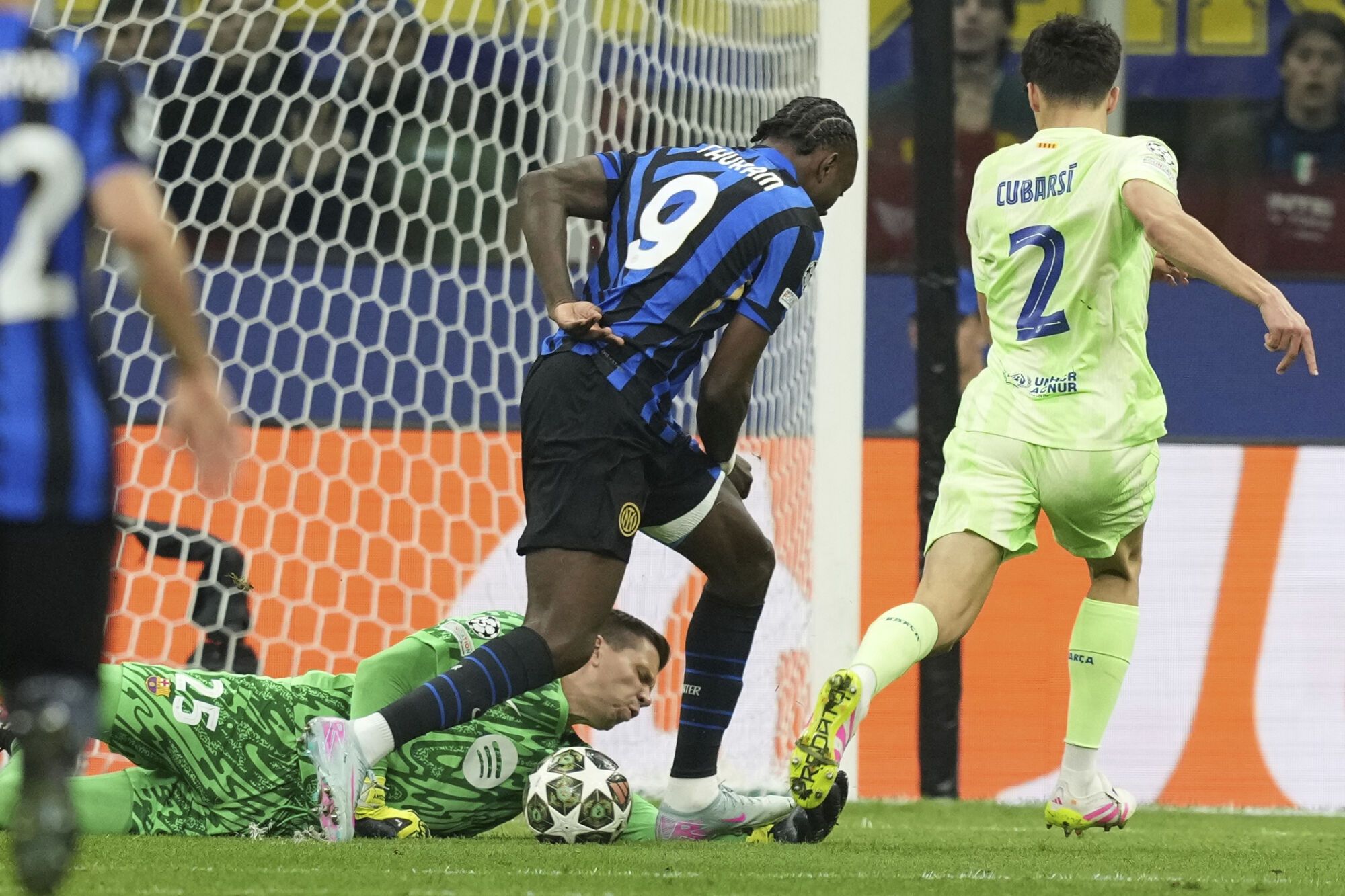 -ba25= saves in front of Inter Milan's Marcus Thuram during the Champions League semifinal second leg soccer match between Inter Milan and Barcelona at San Siro stadium in Milan , Italy, Tuesday, May 6, 2025. (AP Photo/Antonio Calanni). EDITORIAL USE ONLY / ONLY ITALY AND SPAIN