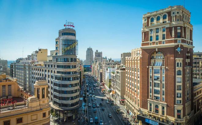 Madrid view along busy Calle Gran Via shopping street Spain