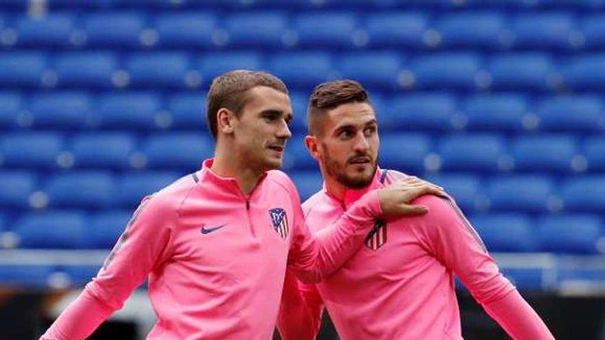 Griezmann y Koke, durante el entrenamiento de ayer.