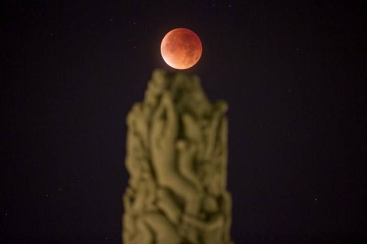 The total "supermoon" lunar eclipse is seen from Vigeland Park in Oslo, Norway