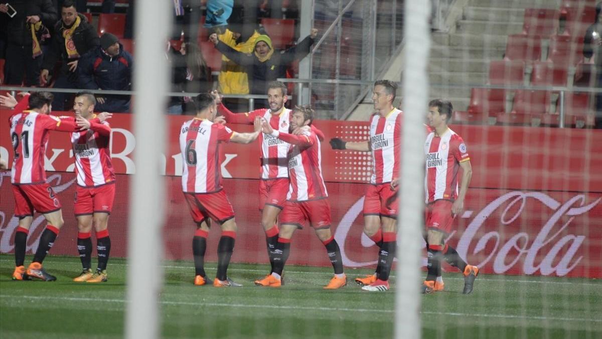 Los jugadores del Girona celebran el gol de Portu ante el Celta.