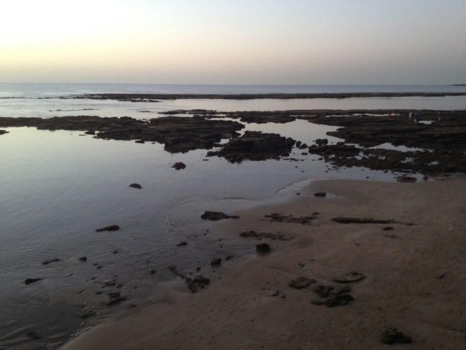 Puesta de sol en Las Canteras con marea baja