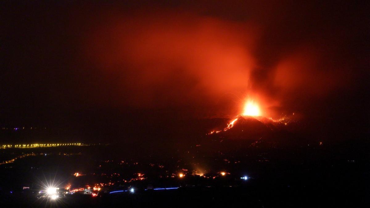 Lava and smoke rise following the eruption of a volcano on the Island of La Palma