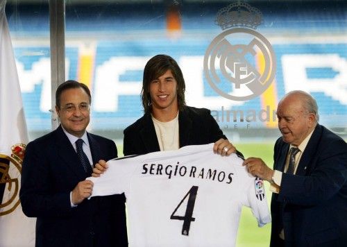 Real Madrid's new signing Ramos holds his jersey at Madrid's Santiago Bernabeu stadium