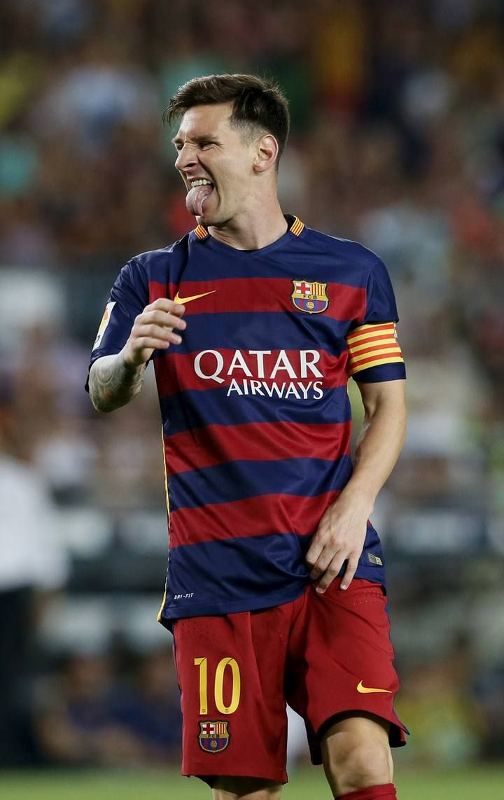 Barcelona's Lionel Messi gestures after missing a goal against AS Roma during a friendly match at Camp Nou stadium in Barcelona