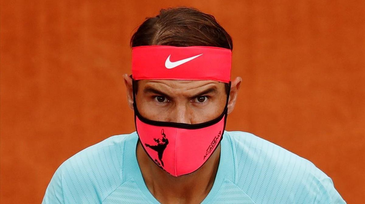 FILE PHOTO  Tennis - French Open - Roland Garros  Paris  France - September 28  2020 Spain s Rafael Nadal wears a protective face mask before his first round match against Belarus  Egor Gerasimov REUTERS Gonzalo Fuentes File Photo