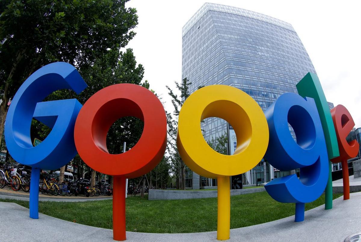 FILE PHOTO  The brand logo of Alphabet Inc s Google is seen outside its office in Beijing  China August 8  2018   Picture taken with a fisheye lens  REUTERS Thomas Peter File Photo