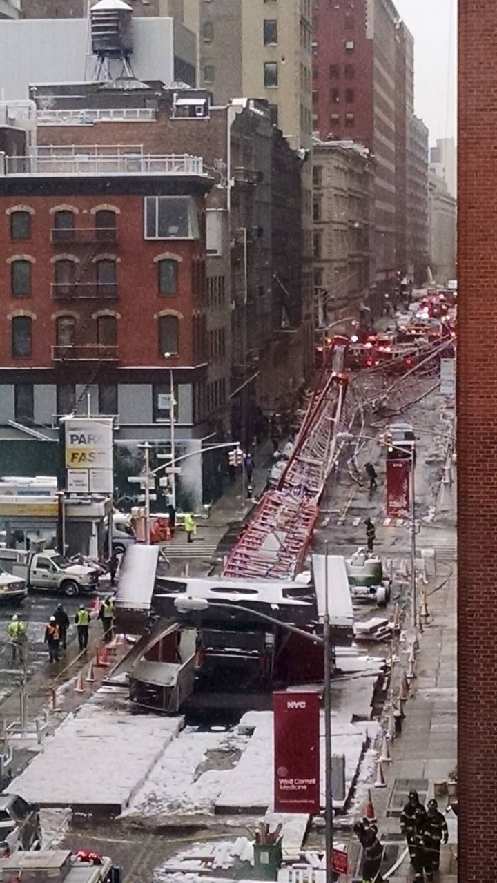 A crane is shown after it collapsed on Worth Street in downtown Manhattan, New York
