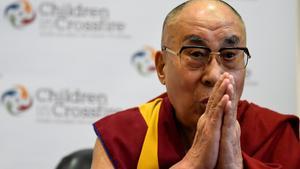 FILE PHOTO: Tibetan spiritual leader the Dalai Lama, Patron of Children in Crossfire, gestures during a press conference in Londonderry, Northern Ireland September 11, 2017. REUTERS/Clodagh Kilcoyne/File Photo