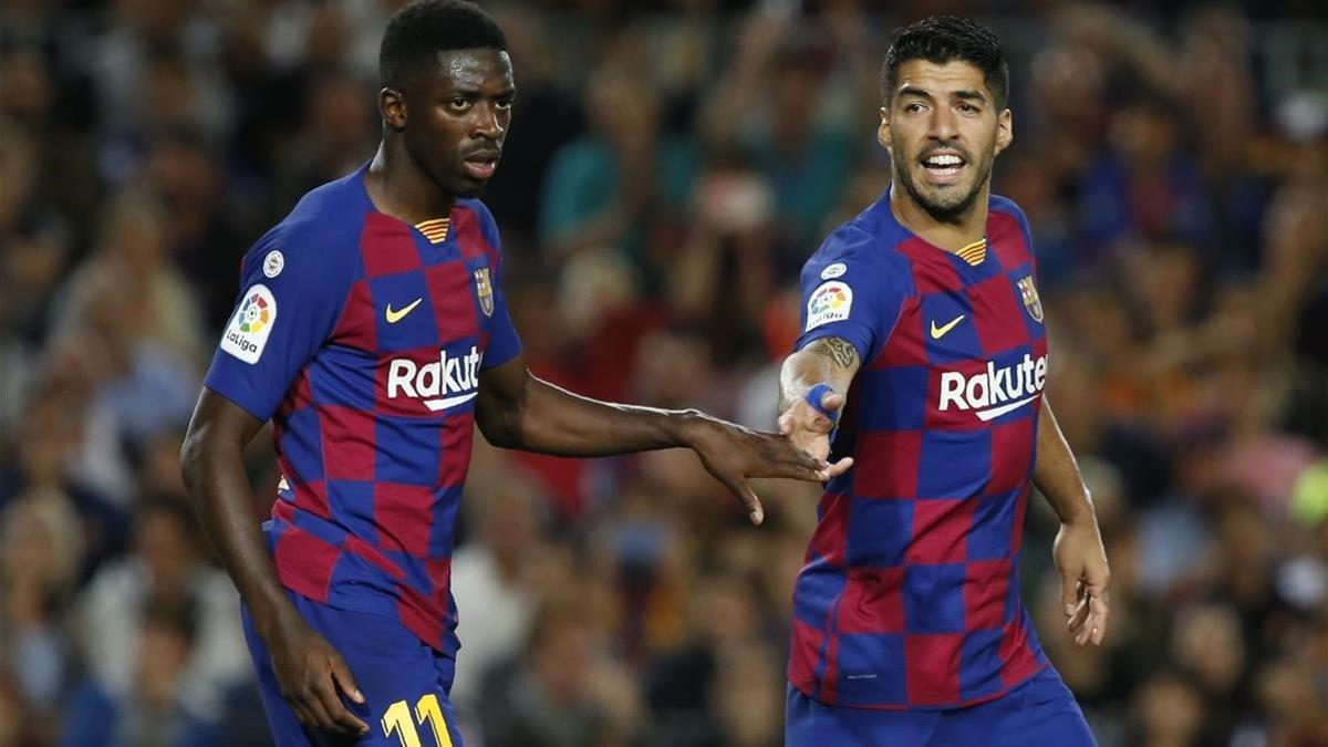 Dembélé y Suárez, en el duelo del Barça contra el Sevilla en el Camp Nou.