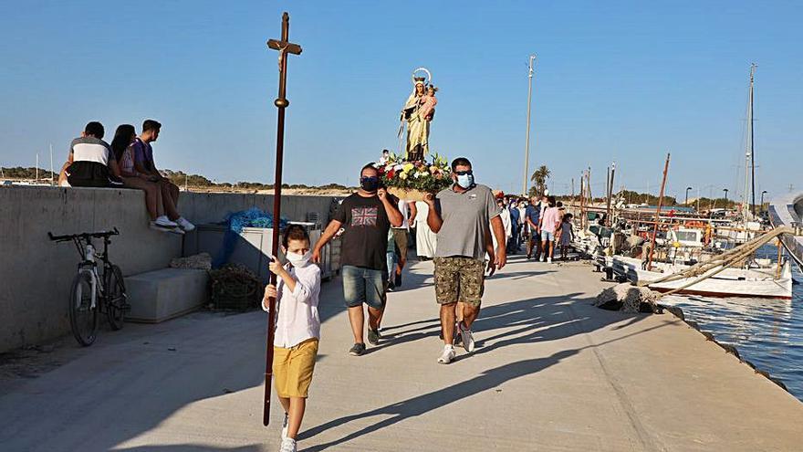 La procesión en el muelle de pescadores de la Savina. | C.C.