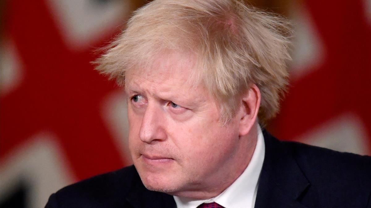 Britain s Prime Minister Boris Johnson looks on during a news conference in response to the ongoing situation with the coronavirus disease (COVID-19) pandemic  inside 10 Downing Street  London  Britain  December 19  2020  REUTERS Toby Melville Pool