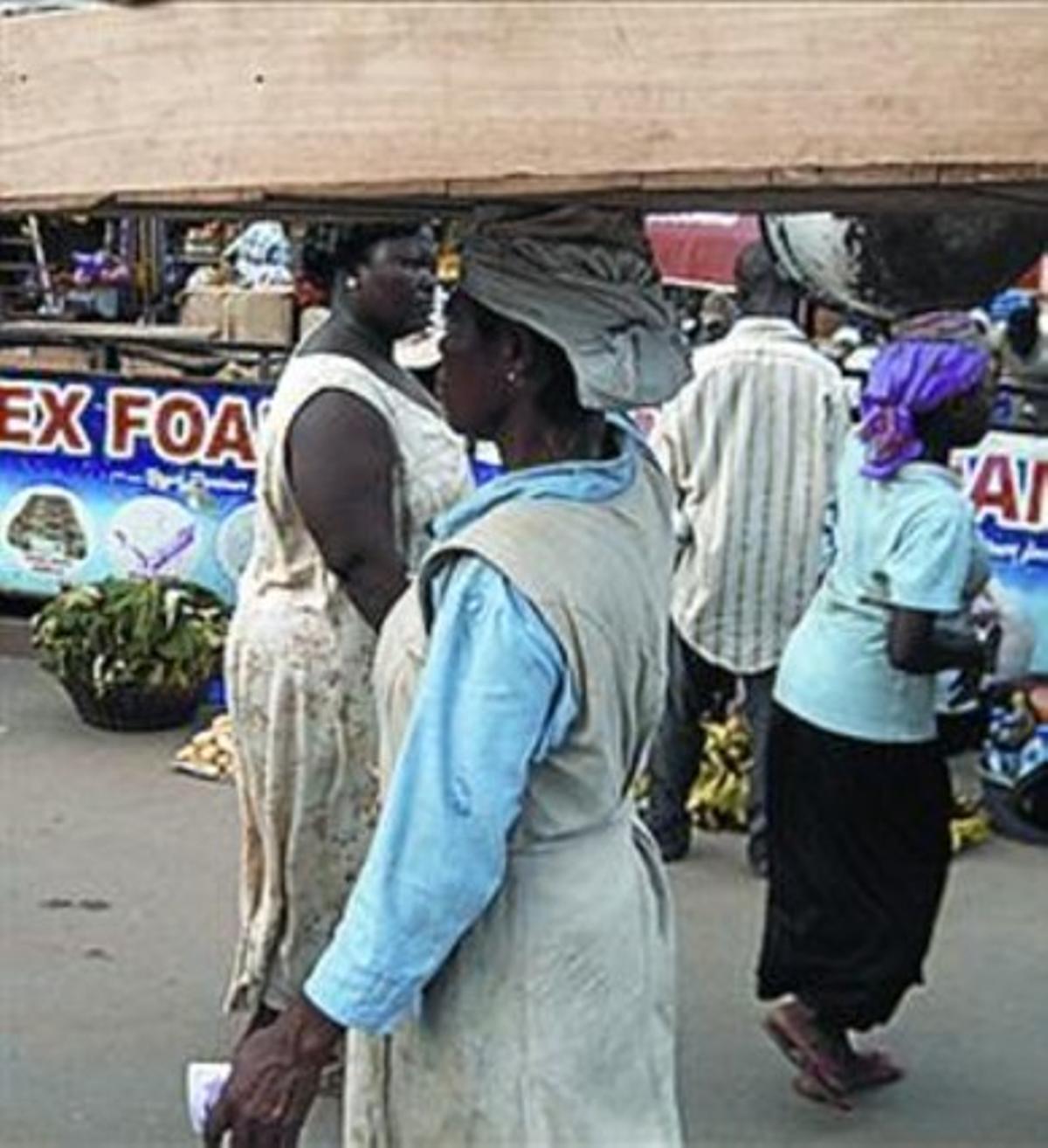 Portadores ashanti a Kumasi. Portadores ashanti a Kumasi.