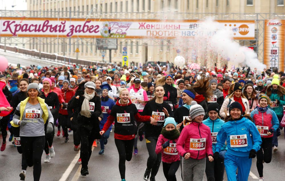 Women participate in the "Beauty Run" to mark ...