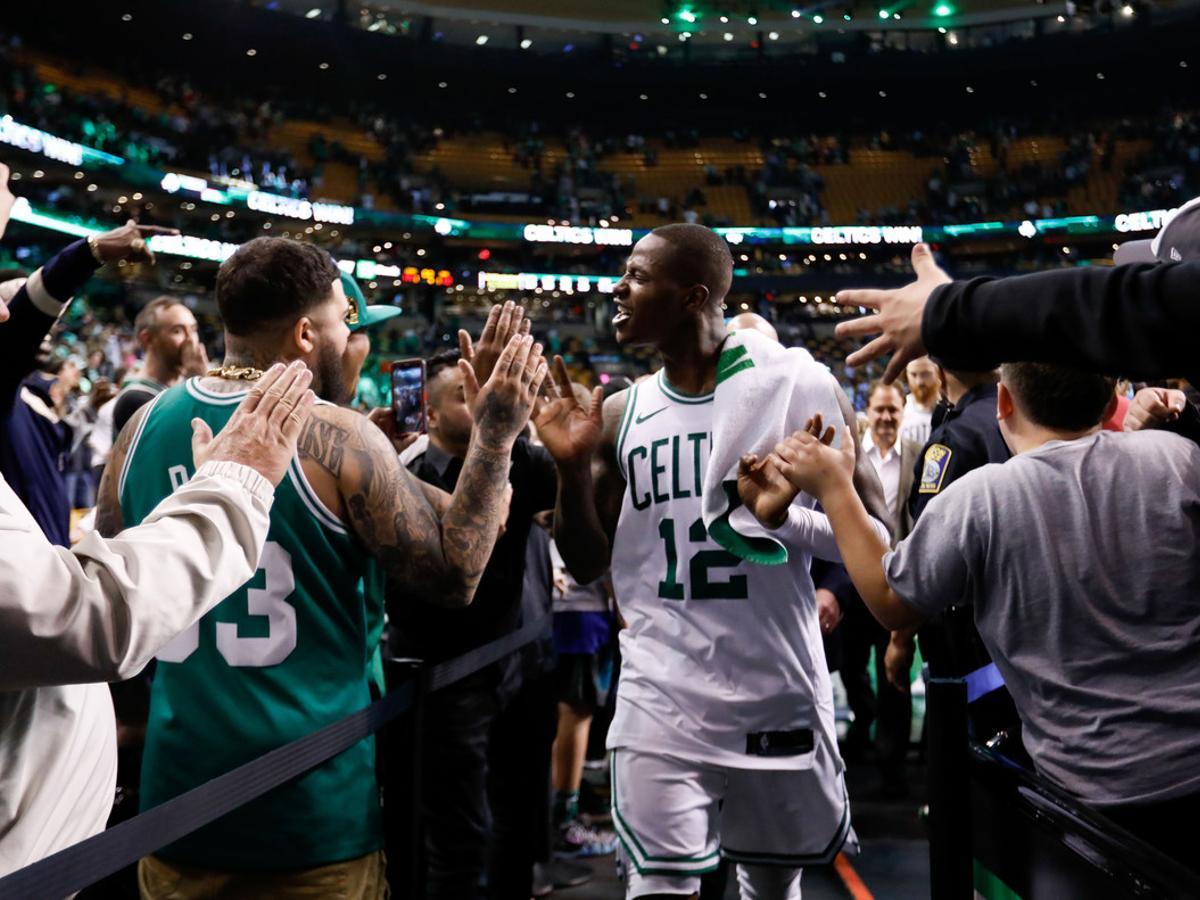May 9, 2018; Boston, MA, USA; Boston Celtics guard Terry Rozier (12) celebrates with fans after defeating the Philadelphia 76ers in game five of the second round of the 2018 NBA Playoffs at the TD Garden. Mandatory Credit: Greg M. Cooper-USA TODAY Sports