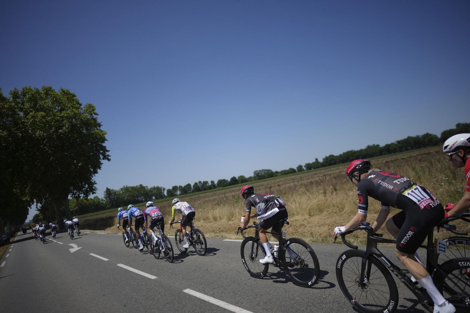 The breakaway group with Australia's Michael Storer, bib 117, and France's Julian Alaphilippe, bib 111, ride in the breakaway during the twelfth stage of the Tour de France cycling race over 180.6 kilometers (112.2 miles) with start in Auch and finish in Hautacam, France, Thursday, July 17, 2025. (AP Photo/Thibault Camus)
