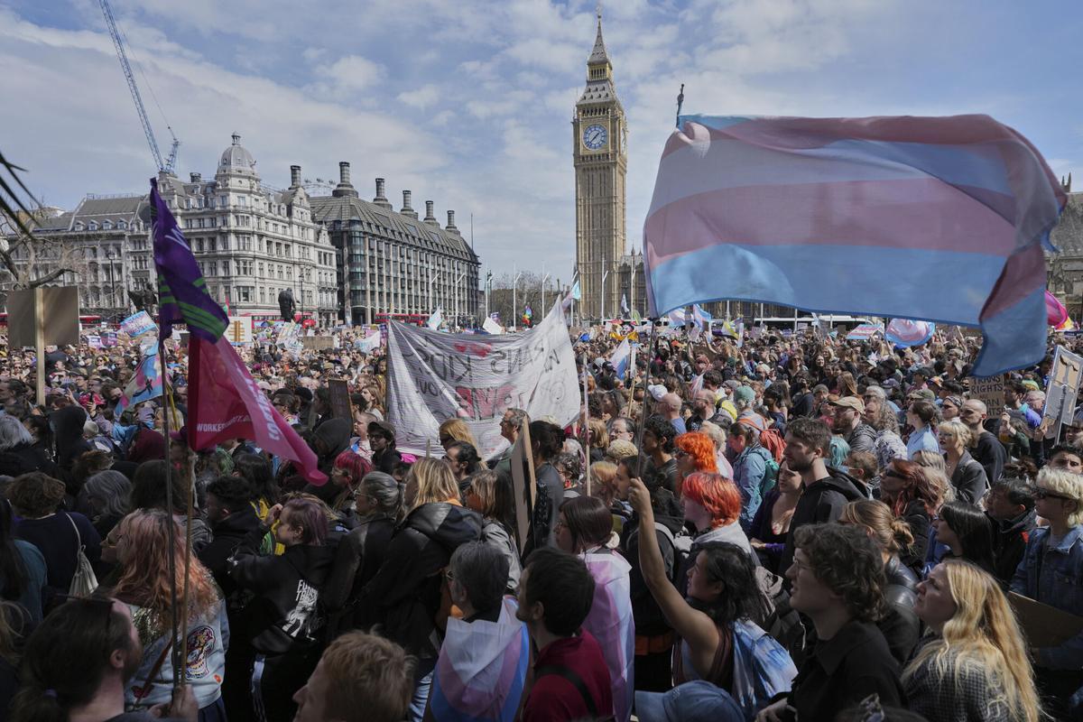 Campaigners take part in a rally organised by trans rights groups, trade unions, and community organisations following the Supreme Court ruling on the definition of a woman in equalities law, at Parliament Square, central London, Saturday April 19, 2025. (AP Photo/Alastair Grant) Campaigners take part in a rally organised by trans rights groups, trade unions, and community organisations following the Supreme Court ruling on the definition of a woman in equalities law, at Parliament Square, central London, Saturday April 19, 2025. (AP Photo/Alastair Grant)