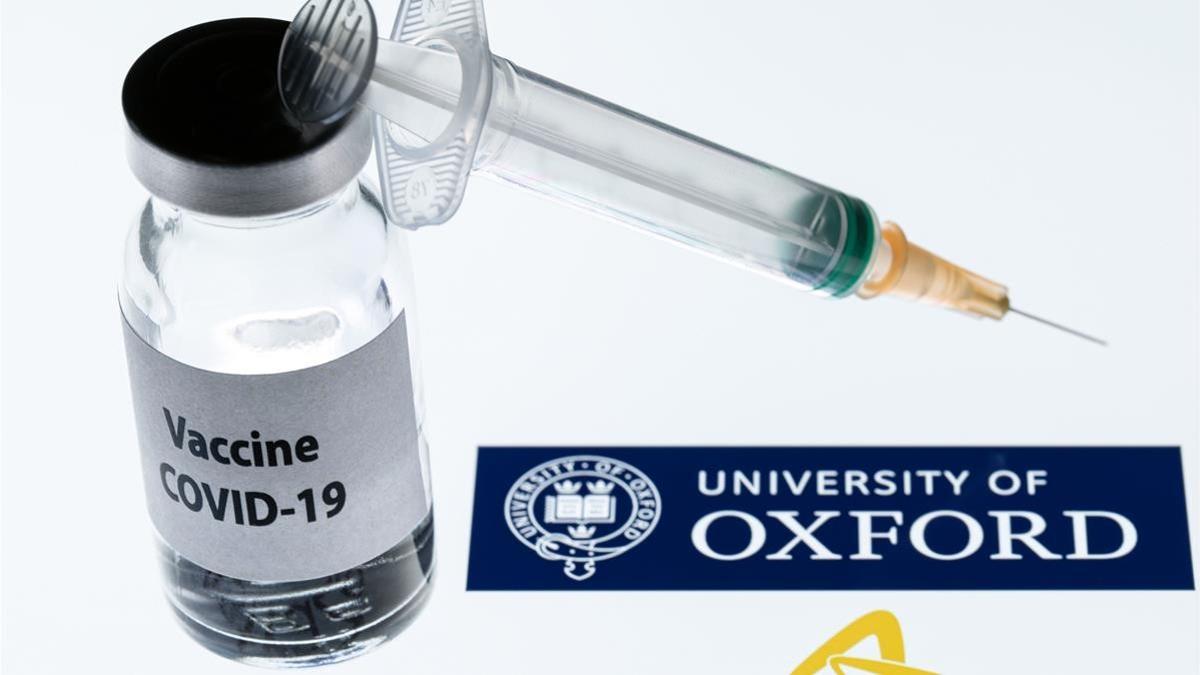 (FILES) In this file photo taken on November 23  2020 This illustration picture taken in Paris shows a syringe and a bottle reading  Covid-19 Vaccine  next to AstraZeneca company and University of Oxford logos  - The University of Oxford and drug manufacturer AstraZeneca have applied to the UK health regulator for permission to roll out their Covid-19 vaccine  Health Minister Matt Hancock said on December 23  2020   I m delighted to be able to tell you that the Oxford AstraZeneca vaccine developed here in the UK has submitted its full data package to the MHRA for approval   he said  (Photo by JOEL SAGET   AFP)