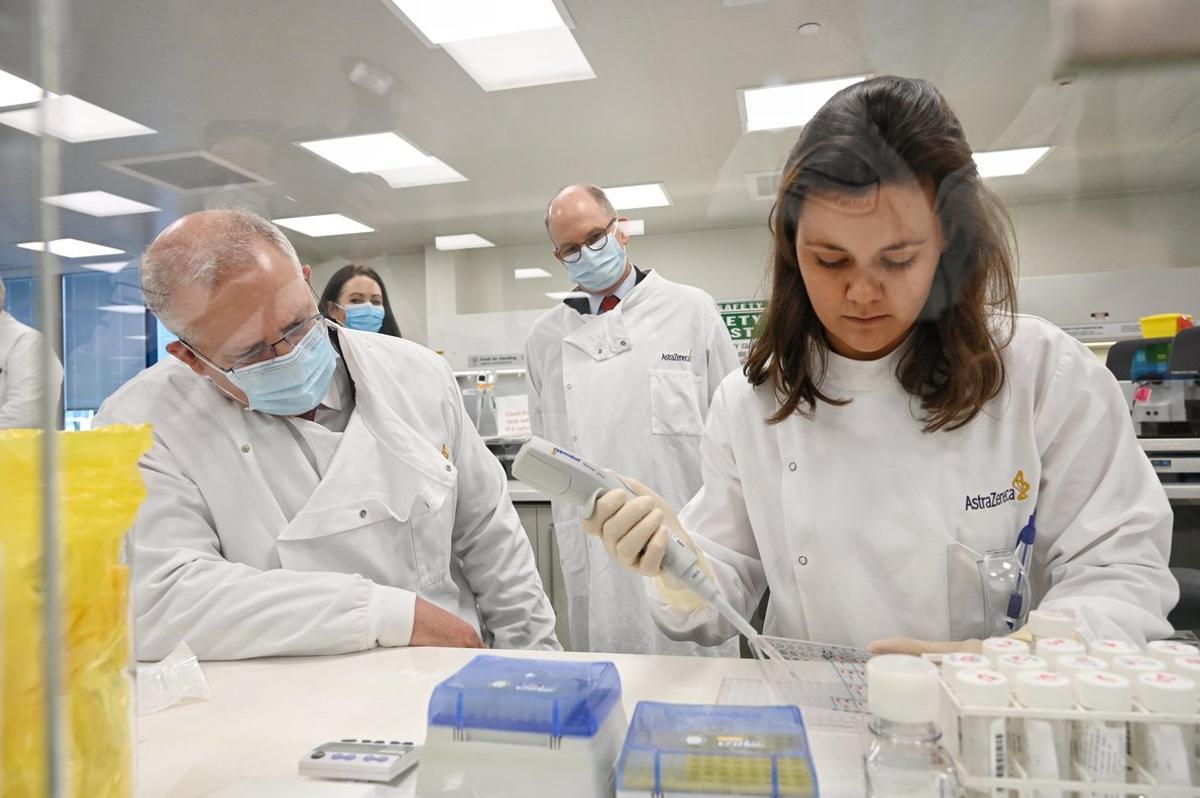 SYDNEY, AUSTRALIA - AUGUST 19: Prime Minister Scott Morrison takes a tour at the AstraZeneca laboratories in Macquarie Park, on August 19, 2020 in Sydney, Australia. The Australian government has announced an agreement with the British pharmaceutical giant AstraZeneca to secure at least 25 million doses of a COVID-19 vaccine if it passes clinical trials.  The University of Oxford COVID-19 vaccine is currently in phase-three testing. If the vaccine proves to be successful, Australia will manufacture and supply vaccines and will be made available for free. The project could deliver the first vaccines by the end of this year or by early 2021. (Photo by Nick Moir - Pool/Getty Images)