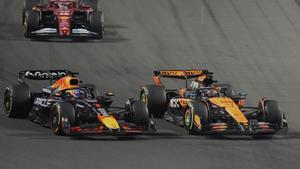 Red Bull driver Max Verstappen of the Netherlands, left, steers his car followed by McLaren driver Oscar Piastri of Australia during the Formula One Saudi Arabian Grand Prix at the Jeddah Corniche Circuit in Jeddah, Saudi Arabia, Sunday, April 20, 2025. (AP Photo/Darko Bandic)