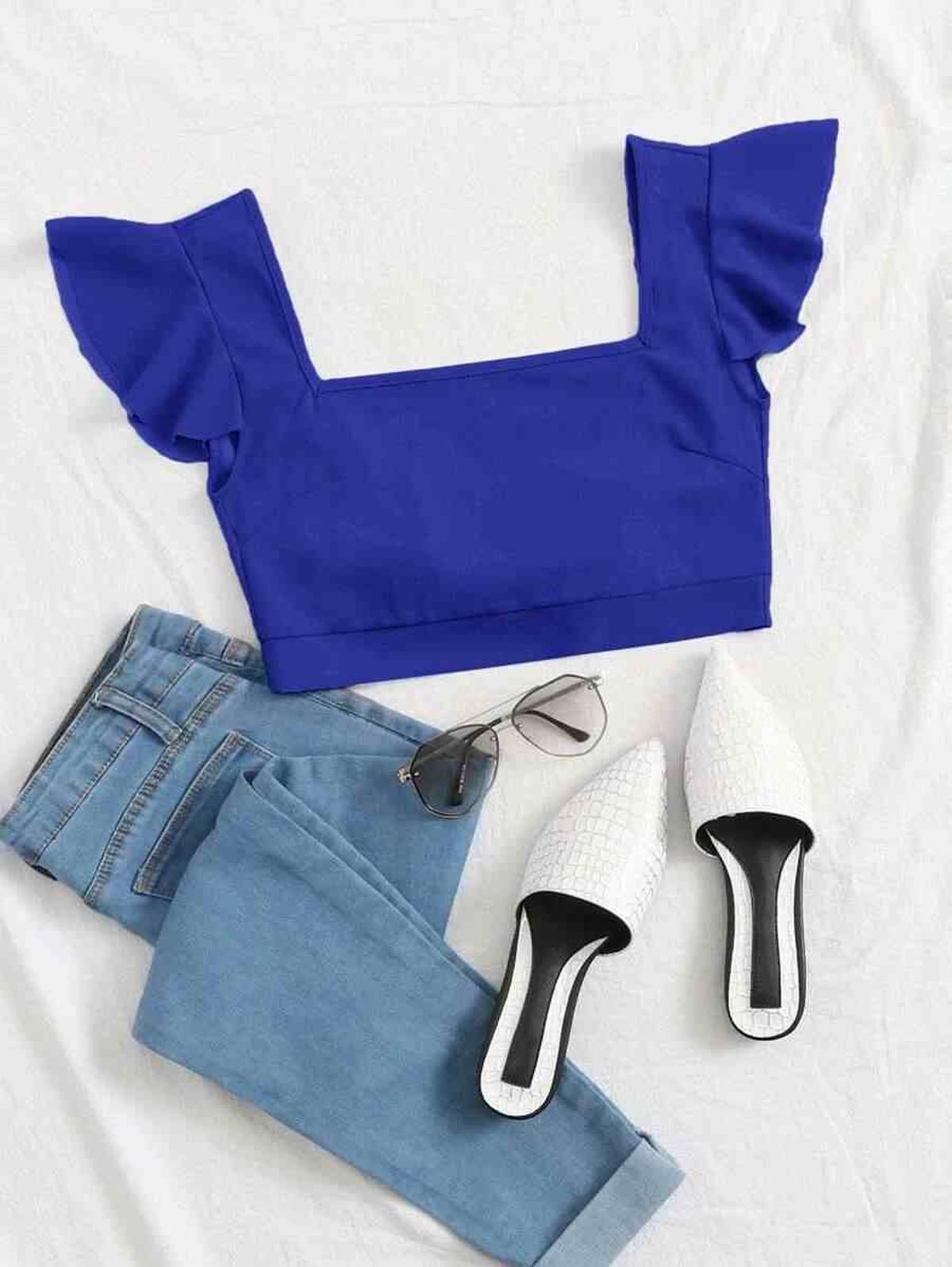 Top azul con lazada en la espalda y volantes Top azul con lazada en la espalda y volantes