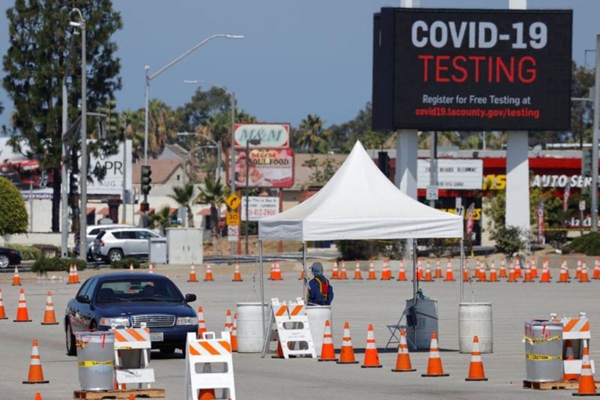 FILE PHOTO: A drive-through testing center is shown in operation during the outbreak of the coronavirus disease (COVID-19) in Inglewood, California, U.S., July 20, 2020. REUTERS/Mike Blake