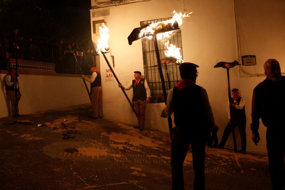 Villagers hold torches during the Divina Pastora ...