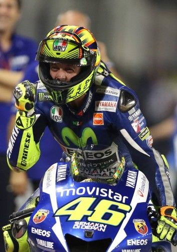 Yamaha MotoGP rider Valentino Rossi of Italy celebrates after crossing the finish line of the Qatar MotoGP Grand Prix at the Losail International circuit in Doha