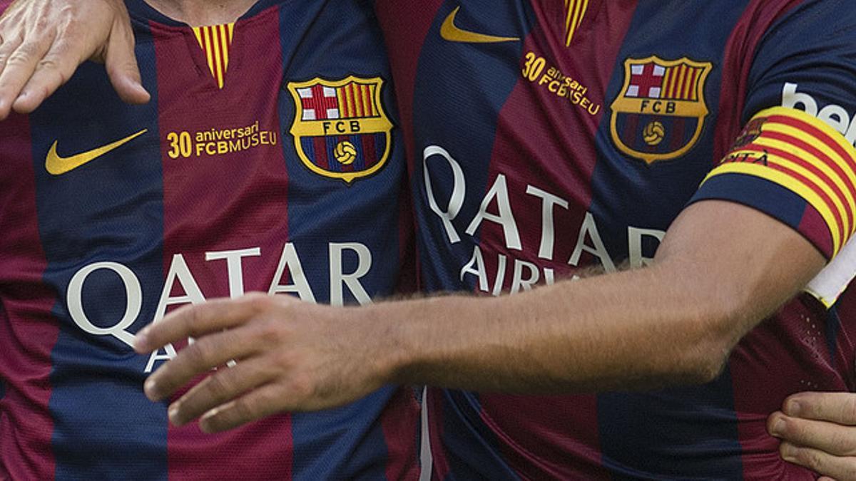 Dos jugadores del Barça, durante un partido en el Camp Nou