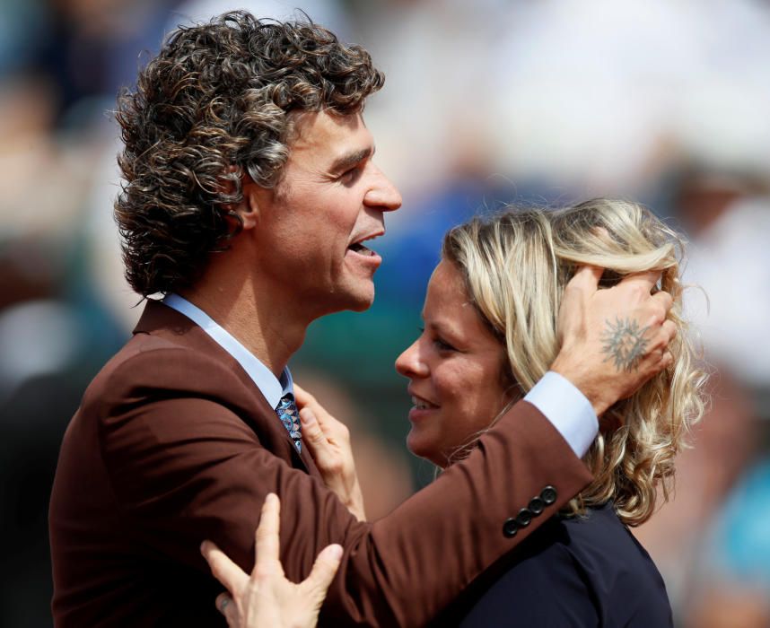 Los extenistas Gustavo Kuerten y Kim Clijsters.