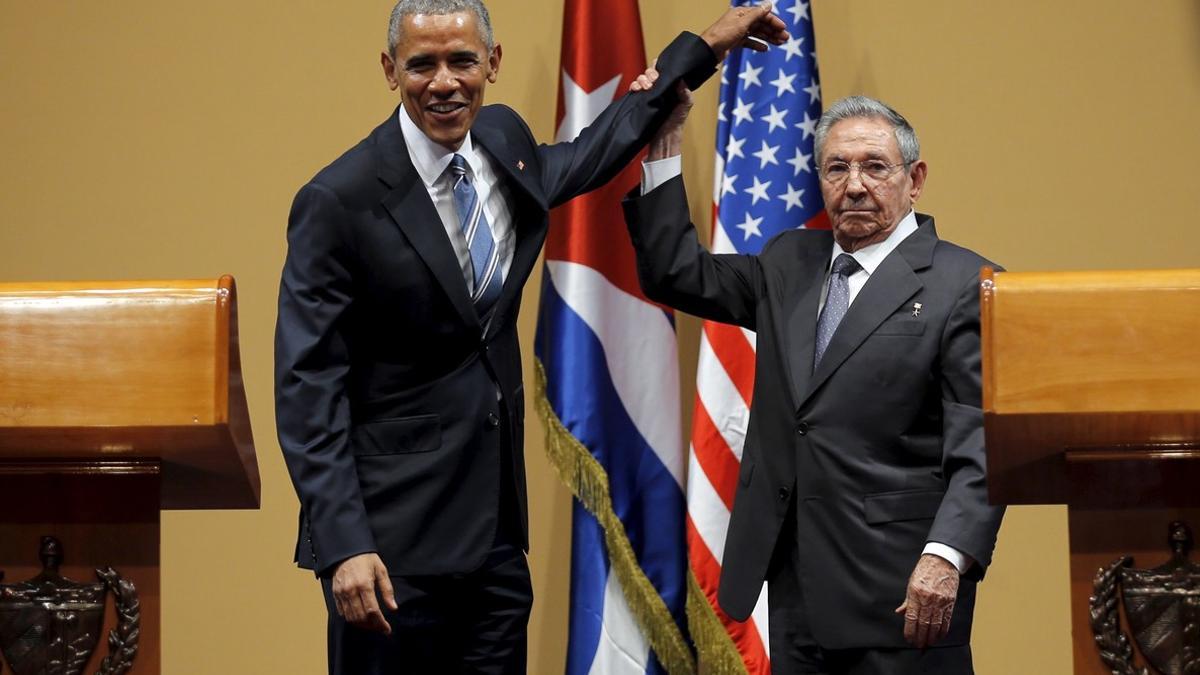 U.S. President Barack Obama and Cuban President Raul Castro gesture after a news conference as part of Obama's three-day visit to Cuba, in Havana