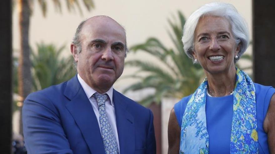 Guindos, con la presidenta del FMI, Christine Lagarde.