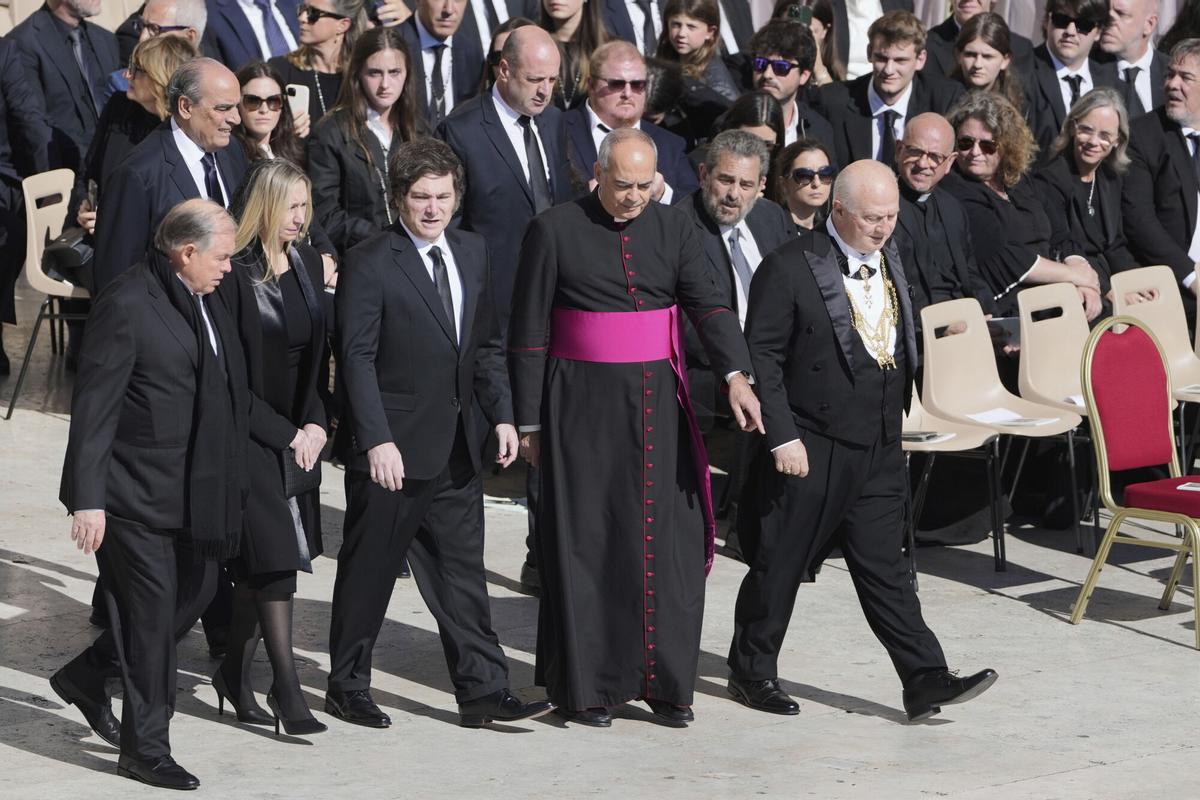 Argentina's President Javier Milei, center left, arrives for the funeral of Pope Francis in St. Peter's Square at the Vatican, Saturday, April 26, 2025. (AP Photo/Markus Schreiber). EDITORIAL USE ONLY/ONLY ITALY AND SPAIN