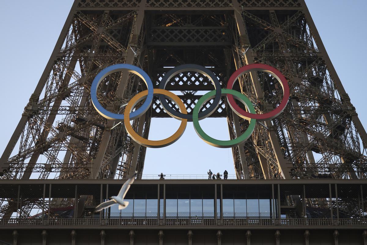 FILE - The Olympic rings are mounted on the Eiffel Tower Friday, June 7, 2024 in Paris.  (AP Photo//Thomas Padilla, File) / FILE