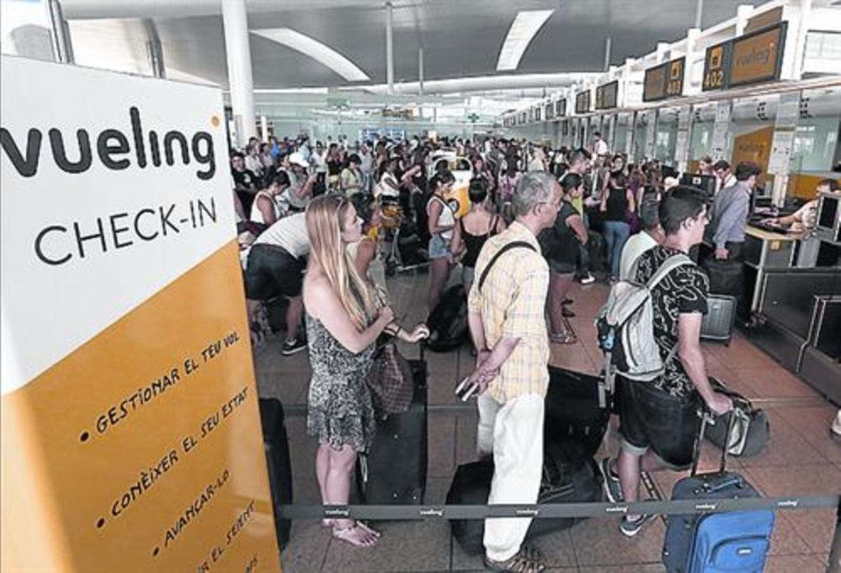 Los mostradores de Vueling de El Prat el 4 de julio. Los mostradores de Vueling de El Prat el 4 de julio.