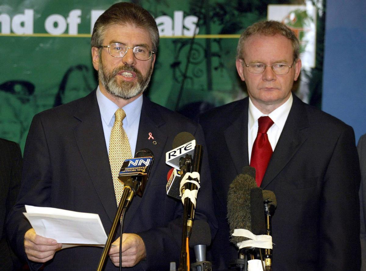 Sinn Fein President Gerry Adams with Martin McGuinness in Belfast, Tuesday, 21 October 2003, as the Northern Ireland peace process was plunged back into crisis after David Trimble’s Ulster Unionists hit out at General John de Chastelain’s disarmament report. Just hours after the Provisionals decommissioned more weapons and explosives than ever before, Mr Trimble said the process had lacked the transparency he had expected. EFE/epa/PAUL FAITH UK AND IRELAND OUT