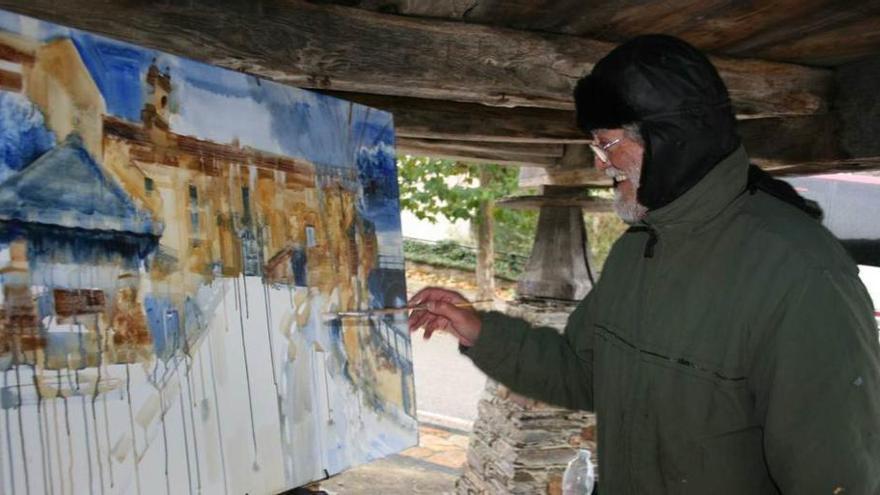 Un participante pinta un cuadro del monasterio de Villanueva en una edición pasada del certamen.