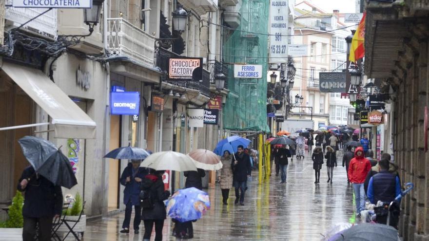 Lluvia en la calle Real de A Coruña.