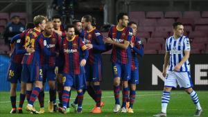 Barcelona players celebrate Barcelona s Spanish defender Jordi Alba s goal during the Spanish league football match between FC Barcelona and Real Sociedad at the Camp Nou stadium in Barcelona on December 16  2020  (Photo by LLUIS GENE   AFP)