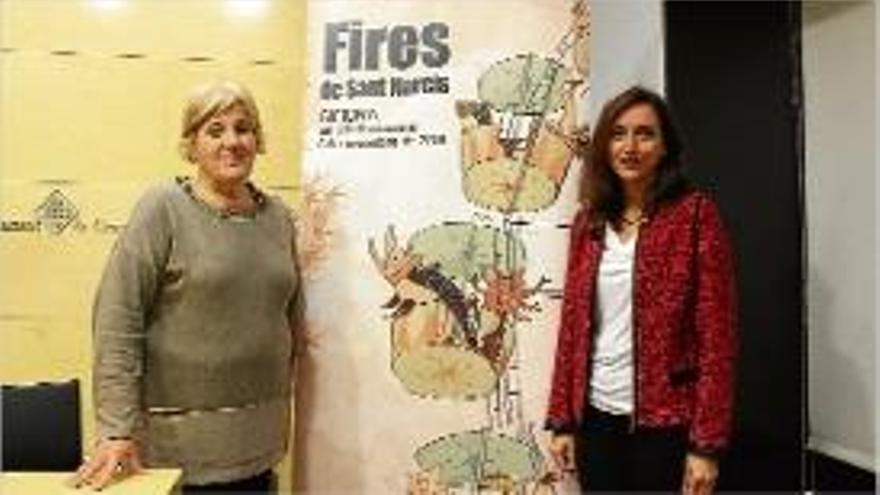 Eva Palau i Carme Vázquez ahir amb el cartell de les Fires.