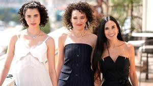 (From L) US actress Margaret Qualley, French director Coralie Fargeat and US actress Demi Moore pose during a photocall for the film The Substance at the 77th edition of the Cannes Film Festival at the Carlton Hotel in Cannes, southern France, on May 19, 2024. (Photo by Stefano RELLANDINI / AFP)