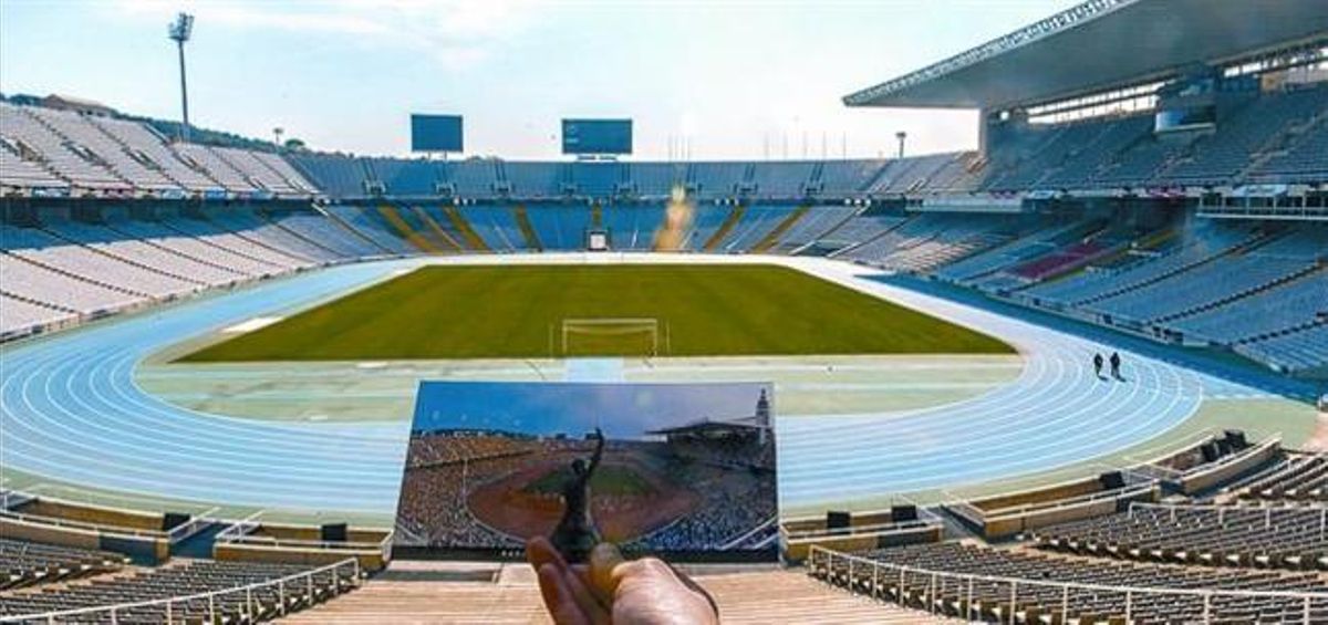 L’Estadi Olímpic Lluís Companys buit, ahir, amb una postal d’un dia de competició en primer terme.