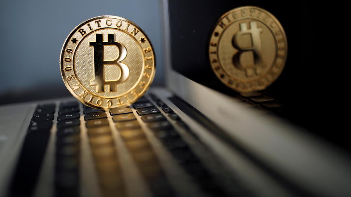 FILE PHOTO: A Bitcoin (virtual currency) coin is seen in an illustration picture taken at La Maison du Bitcoin in Paris