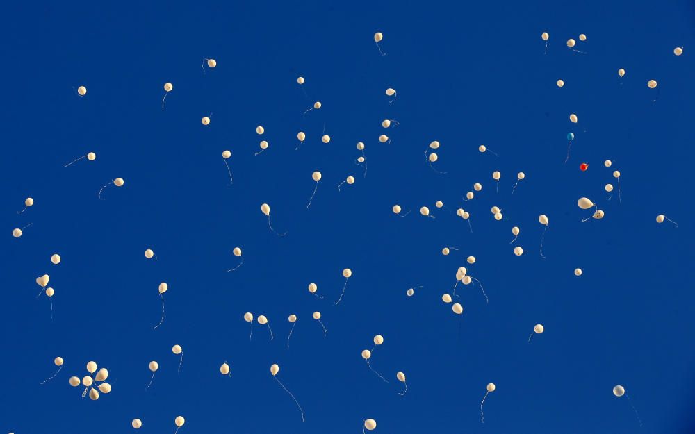 Balloons fly after being released by people who ...