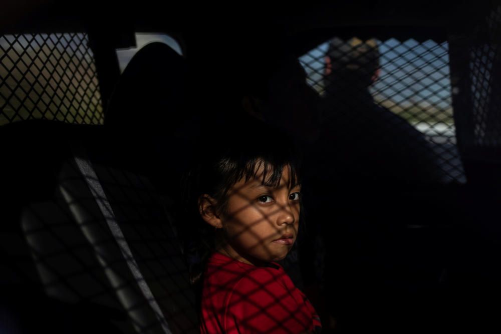 Migrant girl from Guatemala sits detained by ...