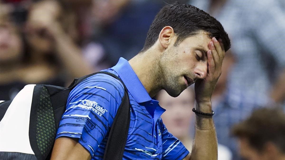 rpaniagua49673303 novak djokovic  of serbia  walks off the court as he retires190902100138