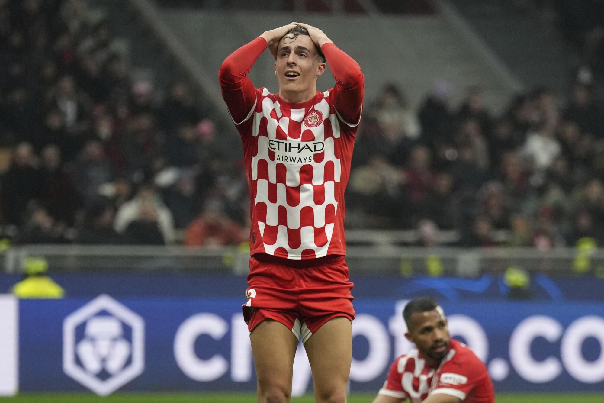 Girona's Alejandro Frances reacts during the Champions League opening phase soccer match between AC Milan and Girona at the San Siro stadium in Milan, Italy, Wednesday, Jan. 22, 2025. (AP Photo/Antonio Calanni). EDITORIAL USE ONLY/ONLY ITALY AND SPAIN
