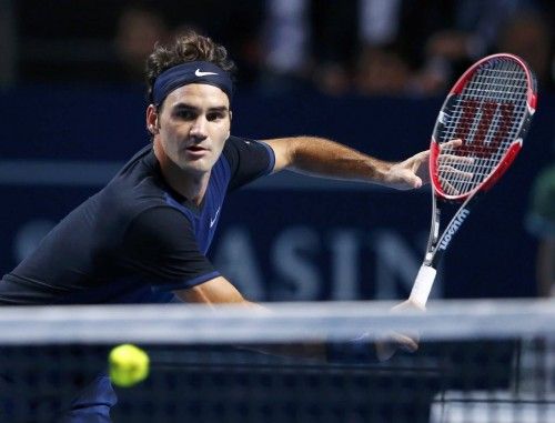 Switzerland's Federer returns a ball to Nadal of Spain during their match at the Swiss Indoors ATP men's tennis tournament in Basel